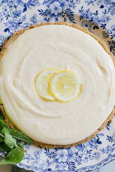 a lemon pie on a blue and white plate