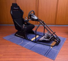 a gaming chair sitting on top of a blue mat