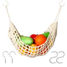 a white netted hammock with fruit in it and two hooks on each side