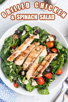 grilled chicken and spinach salad in a white bowl with text overlay that reads grilled chicken & spinach salad