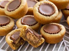 peanut butter cupcakes with chocolate frosting on a cooling rack