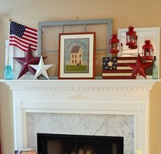 an american flag is on top of a fireplace mantel with candles and other patriotic decorations