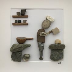 some rocks and other items in a white frame