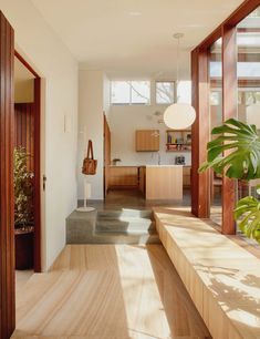 the interior of a modern house with wood accents