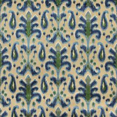 a blue and green pattern on fabric