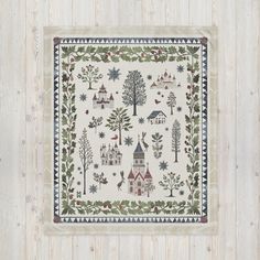 a cross stitch pattern with trees, houses and birds on white wood planks in the background