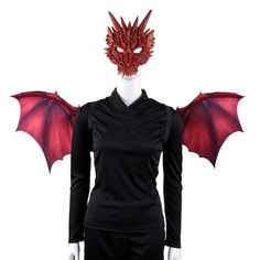 a woman wearing a red dragon mask and black dress