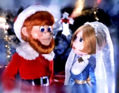 a close up of a person dressed as santa clause and a monkey wearing a wedding dress