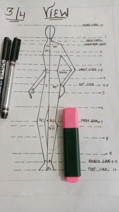 a drawing of a woman's figure and two crayons next to it