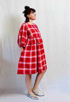 "Red, white and cobalt check linen dress, empire waist, bust darts, side seam pockets, pull on, hand-embroidered abstract design at the bust and neckline. Structured for a better fit and roomy for comfort. Dress it up or wear it to the beach, this dress feels nice and cool in the summer heat.  Handmade to order in our Portland studio. Please check our current lead time on the main page.    CONTENT 100% linen with cotton embroidery   SIZING Current available sizes are: Standard US 10, US 8 and US 6 GARMEN DIMENSIONS US 10 Bust: +/- 20.5\"/ 52.1 cm Waist: +/- 20\"/ 50.8 cm Sleeve length: +/- 17\"/ 43.2 cm  Dress length: +/- 39\"/ 99.1 cm US 8 Bust: +/- 19.5\"/ 49.5 cm Waist: +/- 19\"/ 48.3 cm Sleeve length: +/- 16.5\"/ 41.9 cm  Dress length: +/- 38\"/ 96.5 cm US 6 Bust: +/- 18.5\"/ 47 cm Wai Red Check Dress, Dress Empire Waist, Balloon Dress, Check Dress, Cotton Embroidery, Puffy Sleeves, Summer Heat, Style Expert, Plaid Dress