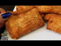 a person is cutting pastries on a white board