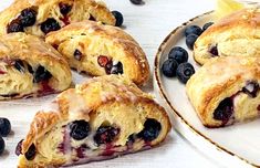 blueberry scones on a plate with lemon wedges