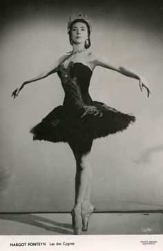 a black and white photo of a ballerina