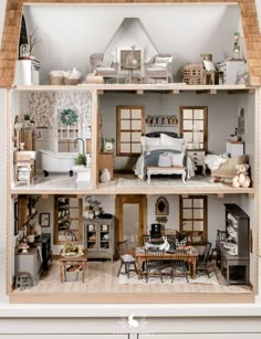 a doll house with all the furniture and accessories in it's rooms, including one bedroom