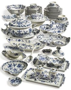 a collection of blue and white china