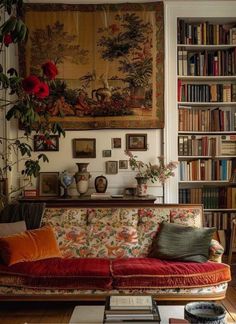 a living room filled with furniture and bookshelves covered in pictures on the wall