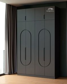 a large gray cabinet with two doors on the front and one door open to reveal another room