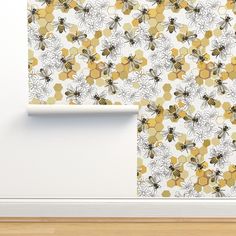 a wall with bees and flowers on it