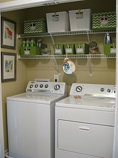 a white washer and dryer sitting next to each other in a laundry room