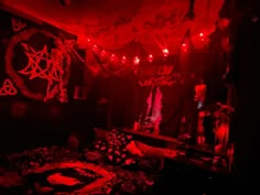 a dark room with red lights and decorations