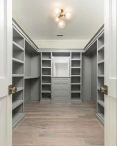 an empty walk in closet with white walls