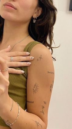 a woman with many tattoos on her arm