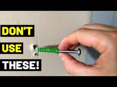 a person is holding a screw in their left hand and pointing to the wall with text that says, don't use these