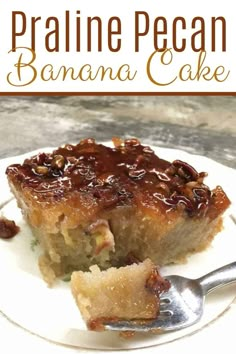 a piece of banana cake on a white plate with a fork in front of it