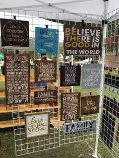 the vendor displays at trade shows is decorated with hand - lettered signs and metal wire