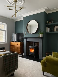 a living room filled with furniture and a fire place