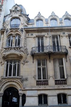 an old building with many windows and balconies