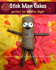 a stick man cake made out of chocolate and candy on top of leaves with the words stick man cakes perfect for bonfire night