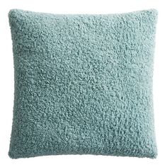 a blue pillow on a white background