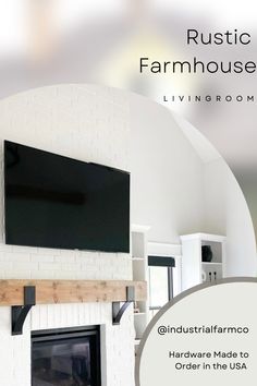 a living room with a flat screen tv mounted to the wall above a fire place