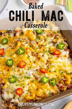 baked chili mac casserole in a baking dish with cheese and peppers on top