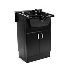 a black sink sitting on top of a cabinet next to a faucet soap dispenser