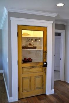 a yellow door with an advertisement on the front and side glass for panty bakery