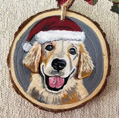 a wooden ornament with a dog wearing a santa hat