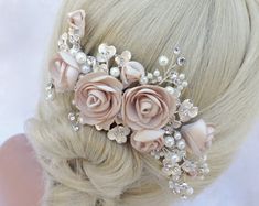 a woman with blonde hair wearing a pink flower and pearl headpiece in her hair