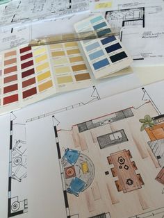 the floor plan and color swatches are on top of blueprints