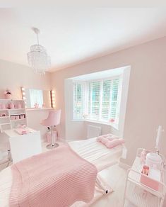 a white and pink bedroom with lots of storage in the closets on the wall