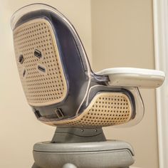 an office chair with a computer arm rest on top of it's backrest