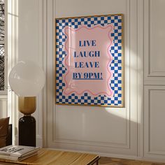 a living room scene with focus on the framed poster and table in the foreground