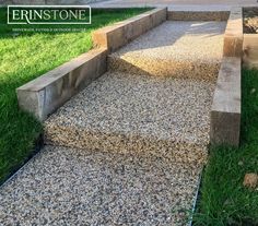 the steps are made out of wood and gravel, with grass growing in between them