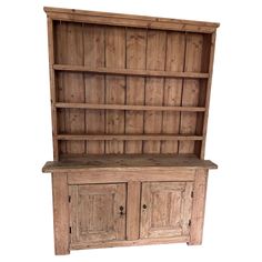 an old wooden bookcase with doors and drawers