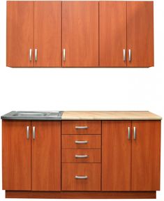 a kitchen with wooden cabinets and stainless steel sink in front of white wall behind it