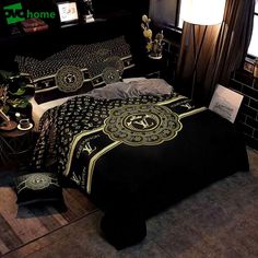 a bed with black and gold comforters in a room