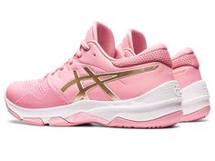 a pink and gold running shoe on a white background