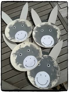 three paper plates with donkey faces on them