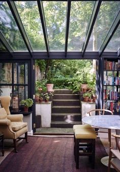 an image of a room with stairs and plants